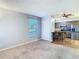 Open concept living room and kitchen with neutral decor and carpet at 4531 Blossom Blvd # 4531, Zephyrhills, FL 33542