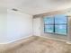 Living room with neutral walls, carpet, and a window offering natural light at 4531 Blossom Blvd # 4531, Zephyrhills, FL 33542