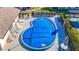 Community pool with lounge chairs and covered seating at 4531 Blossom Blvd # 4531, Zephyrhills, FL 33542
