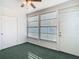Bright sunroom with windows, carpet, and ceiling fan at 4531 Blossom Blvd # 4531, Zephyrhills, FL 33542