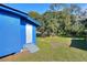Blue house with a spacious backyard and detached structure at 1106 Powell St, Plant City, FL 33563