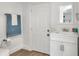 Clean bathroom with white vanity and wood-look floors at 1106 Powell St, Plant City, FL 33563