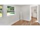 Bedroom with large windows and mirror, near bathroom at 1106 Powell St, Plant City, FL 33563