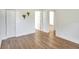 Well-lit bedroom with wood floors and access to other rooms at 1106 Powell St, Plant City, FL 33563