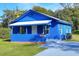 Newly renovated bright blue house with front porch at 1106 Powell St, Plant City, FL 33563