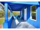 Inviting blue front porch with two teal adirondack chairs at 1106 Powell St, Plant City, FL 33563
