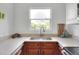 Modern kitchen with a farmhouse sink and wood cabinets at 1106 Powell St, Plant City, FL 33563