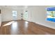 Bright living room featuring hardwood floors and large windows at 1106 Powell St, Plant City, FL 33563