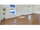 Spacious living area with hardwood floors and ample natural light at 1106 Powell St, Plant City, FL 33563