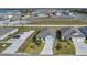 Aerial view of two houses with driveways and grassy yards at 3510 N Maryland Ave, Plant City, FL 33565