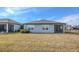 House exterior view showcasing backyard and screened porch at 3510 N Maryland Ave, Plant City, FL 33565