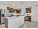 Updated kitchen featuring dark wood cabinets and stainless steel appliances at 3510 N Maryland Ave, Plant City, FL 33565
