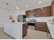 Modern kitchen with stainless steel appliances and an island at 3510 N Maryland Ave, Plant City, FL 33565