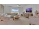 Bright living room with sectional sofa and large TV at 3510 N Maryland Ave, Plant City, FL 33565