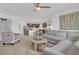 Open living space featuring a sectional sofa and kitchen views at 3510 N Maryland Ave, Plant City, FL 33565