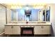 Bathroom with double vanity and a large mirror at 3633 Nettle Creek Ct, Holiday, FL 34691