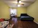 Cozy bedroom with wood floors and access to backyard at 3633 Nettle Creek Ct, Holiday, FL 34691
