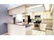 Modern kitchen with stainless steel appliances and granite countertops at 3633 Nettle Creek Ct, Holiday, FL 34691