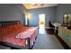 Spacious main bedroom with wood floors and a view of the backyard at 3633 Nettle Creek Ct, Holiday, FL 34691
