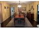 Elegant dining room with a large wood table and chandelier at 750 Charlie Taylor Rd, Plant City, FL 33566