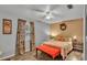 Bedroom with a comfortable bed, a decorative wreath, and patterned curtains at 1701 Charles Ave, Plant City, FL 33563