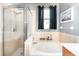 Relaxing bathroom with soaking tub, shower, and updated fixtures at 269 Fairmont Dr, Spring Hill, FL 34609