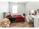 Charming bedroom with a queen bed, desk and large mirror at 269 Fairmont Dr, Spring Hill, FL 34609