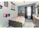 Bright bedroom featuring a gray bed and wall decor at 269 Fairmont Dr, Spring Hill, FL 34609