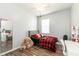 Cozy bedroom with a queen bed, desk and plenty of light at 269 Fairmont Dr, Spring Hill, FL 34609