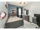 Cozy bedroom with a gray bed frame and a window at 269 Fairmont Dr, Spring Hill, FL 34609