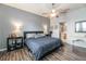 Bright bedroom featuring a comfortable bed and en-suite bathroom access at 269 Fairmont Dr, Spring Hill, FL 34609