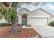 One-story house with a two-car garage and a landscaped yard at 269 Fairmont Dr, Spring Hill, FL 34609