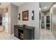 Clean hallway with dark wood console table and access to bedrooms at 269 Fairmont Dr, Spring Hill, FL 34609