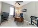 Home office with a large desk, comfortable chair and printer at 269 Fairmont Dr, Spring Hill, FL 34609