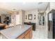 Eat in kitchen with granite countertop and black appliances at 269 Fairmont Dr, Spring Hill, FL 34609