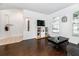 Living room with hardwood floors, a couch, and a flat screen TV at 269 Fairmont Dr, Spring Hill, FL 34609