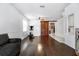 Living room with hardwood floors, a couch, and a barn door at 269 Fairmont Dr, Spring Hill, FL 34609