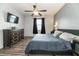 Main bedroom with king-size bed, ceiling fan, and ample closet space at 269 Fairmont Dr, Spring Hill, FL 34609