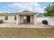Large covered patio with built-in grill at 269 Fairmont Dr, Spring Hill, FL 34609