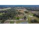 Aerial view of a home on a large lot with a pond at 5401 Peeples Rd, Plant City, FL 33565