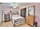 Bedroom with a full bed, dresser, and recliner chair at 5401 Peeples Rd, Plant City, FL 33565