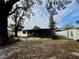 Backyard view of house and fenced yard at 10937 N Lantana Ave, Tampa, FL 33612