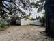 Backyard with shed, large tree, and open space at 10937 N Lantana Ave, Tampa, FL 33612