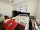 Bedroom with a double bed, dresser, and ceiling fan at 10937 N Lantana Ave, Tampa, FL 33612