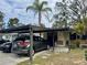 Covered carport with parking for two cars at 10937 N Lantana Ave, Tampa, FL 33612