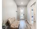 Light-filled entryway with bench and wood-look floors at 11701 Brighton Knoll Loop, Riverview, FL 33579