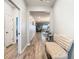 Bright entryway with light wood flooring and a bench at 11701 Brighton Knoll Loop, Riverview, FL 33579