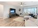 Relaxing living room with sectional sofa and large windows at 11701 Brighton Knoll Loop, Riverview, FL 33579