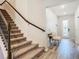 Modern staircase with metal railing and carpet at 11701 Brighton Knoll Loop, Riverview, FL 33579