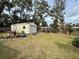 Large backyard with shed and grassy area at 122 Gulf Breeze Blvd, Venice, FL 34293